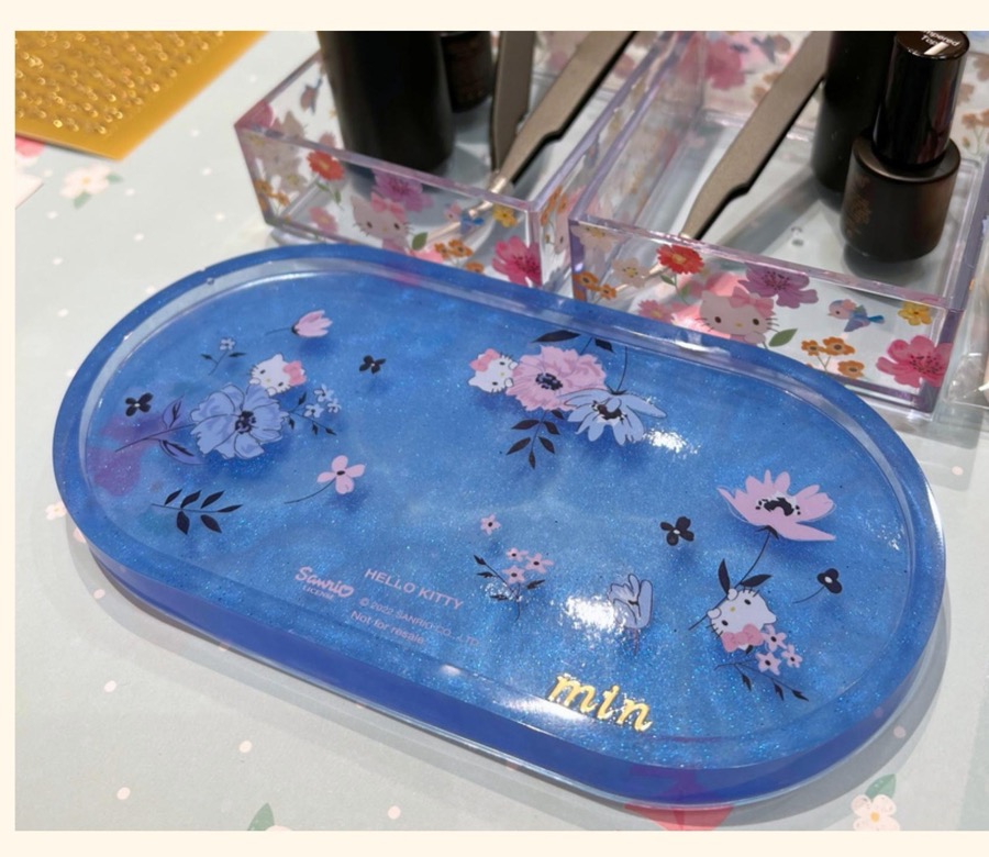 Finished Sanrio Hello Kitty resin coaster with a personalised name and floral design
